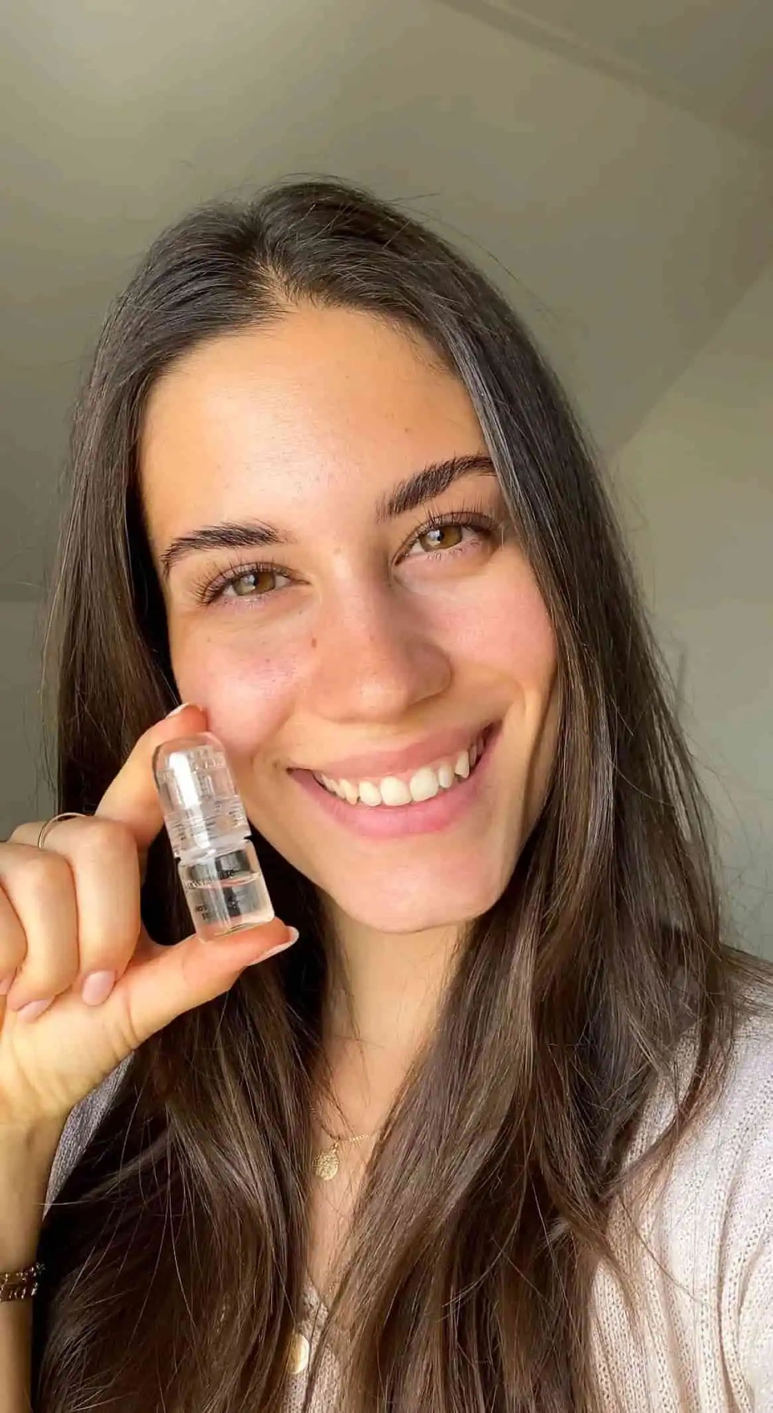 A satisfied customer takes a selfie with the product