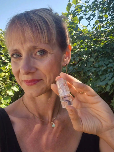 A satisfied customer takes a selfie with the product