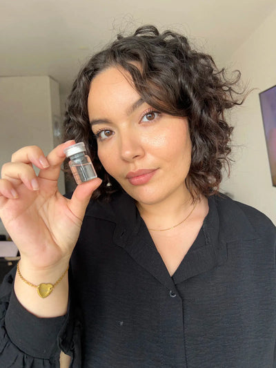 A satisfied customer takes a selfie with the product