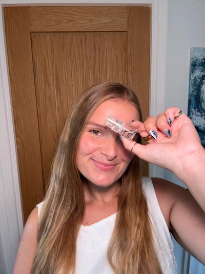 A satisfied customer takes a selfie with the product.